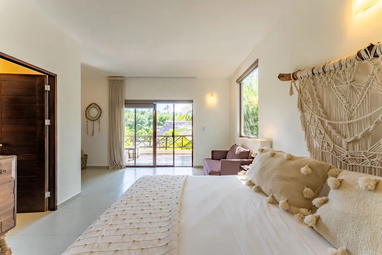 Bassé Clinic Bedroom — single-occupancy room with king bed and private bathroom